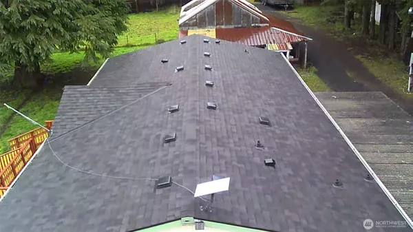 a aerial view of a house with a yard