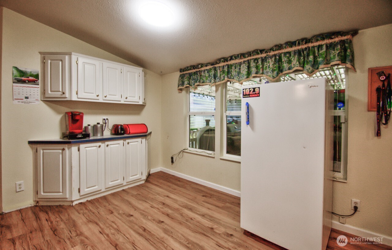 307 South 3rd Street Pe Ell, WA 98572 - Photo 4 of 29 a kitchen with stainless steel appliances a refrigerator and a cabinets