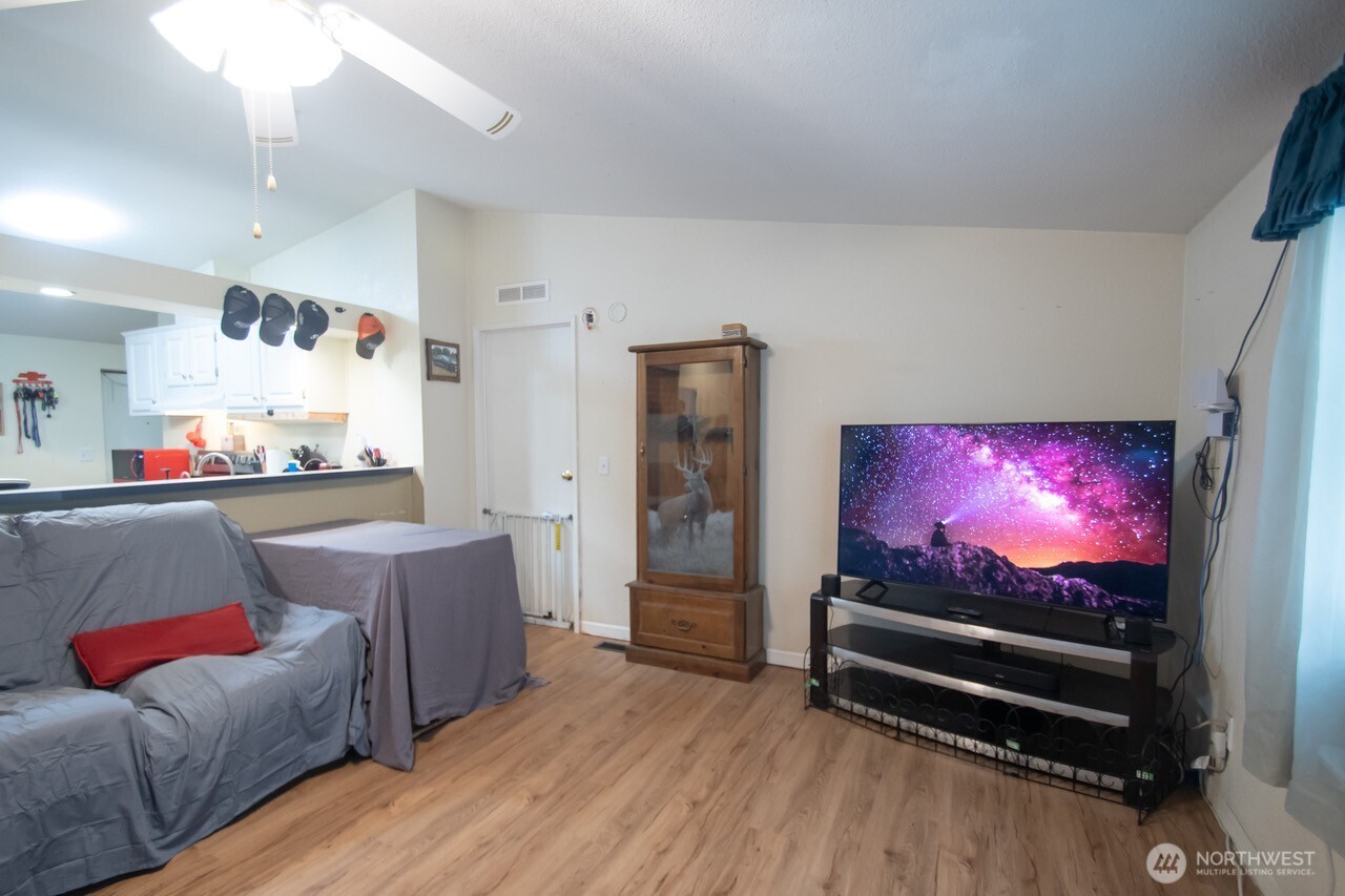 307 South 3rd Street Pe Ell, WA 98572 - Photo 8 of 29 a living room with furniture and a flat screen tv