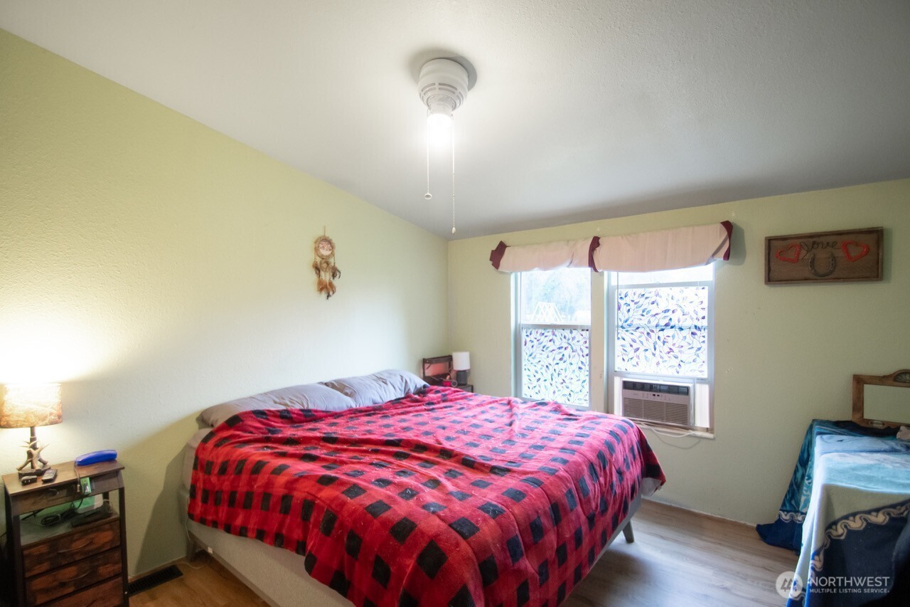 307 South 3rd Street Pe Ell, WA 98572 - Photo 10 of 29 a bedroom with a bed and a window