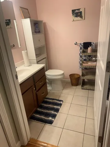 a bathroom with a washing machine and a sink