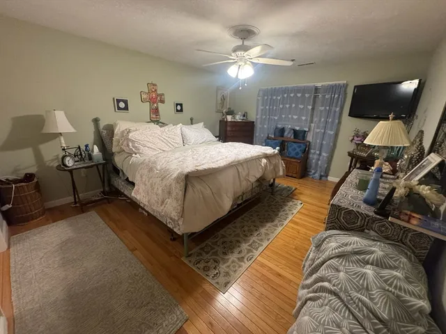 a bed room with a bed window and a chair
