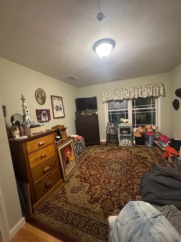 a room with furniture and a flat screen tv