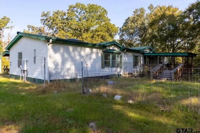 a large kitchen with a table and chairs in it