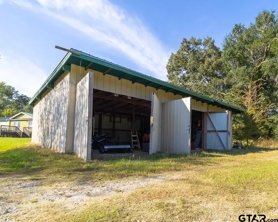a view of a field with an ocean and mountain view