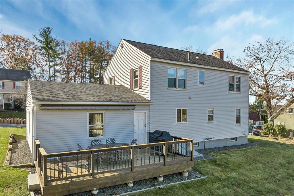 12 Emerson Road Nashua, NH 03062 - Photo 8 of 42 a view of backyard with seating space and yard