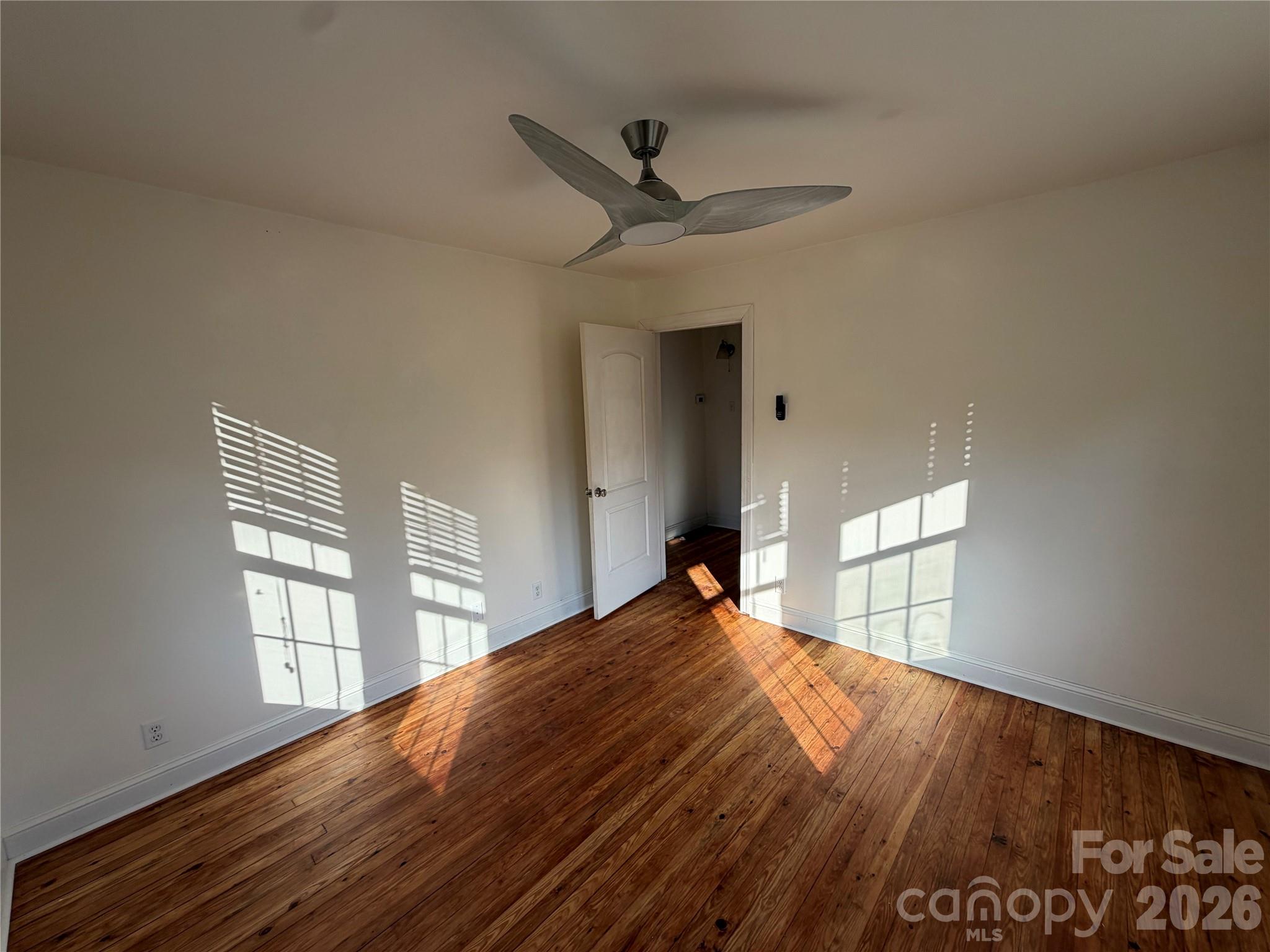 405 Jug Wilson Street Morganton, NC 28655 - Photo 11 of 21 a bedroom with a bed and a large window