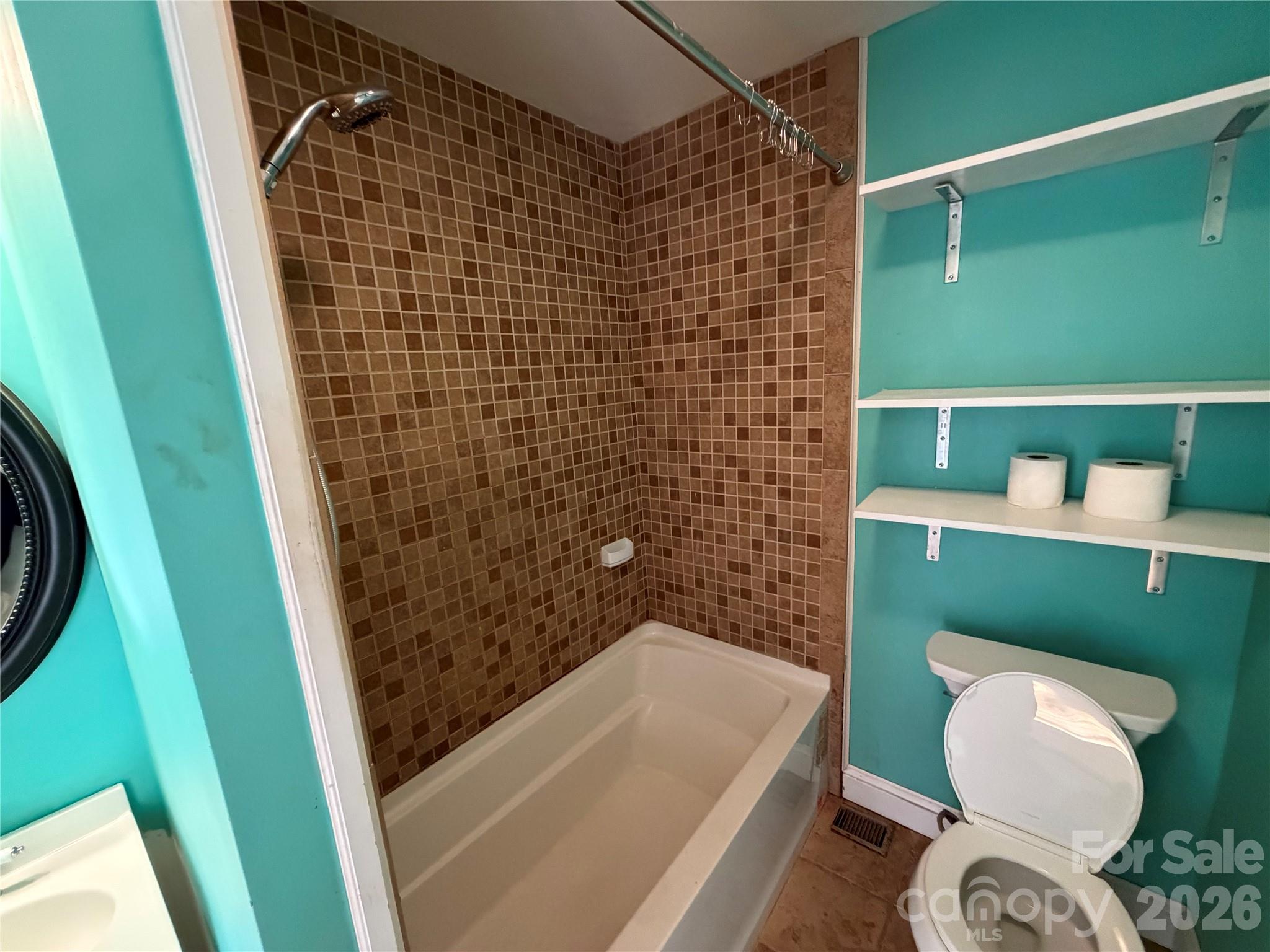 405 Jug Wilson Street Morganton, NC 28655 - Photo 12 of 21 a bathroom with a sink and a mirror