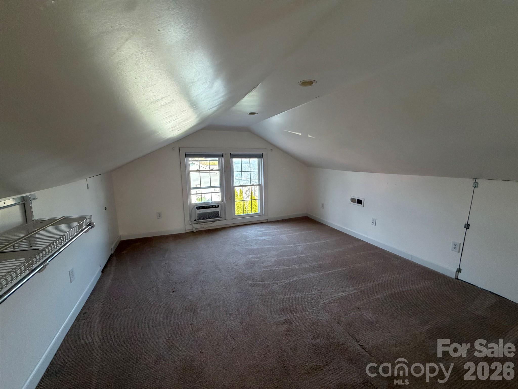 405 Jug Wilson Street Morganton, NC 28655 - Photo 14 of 21 a view of an empty room with a window and a kitchen counter top