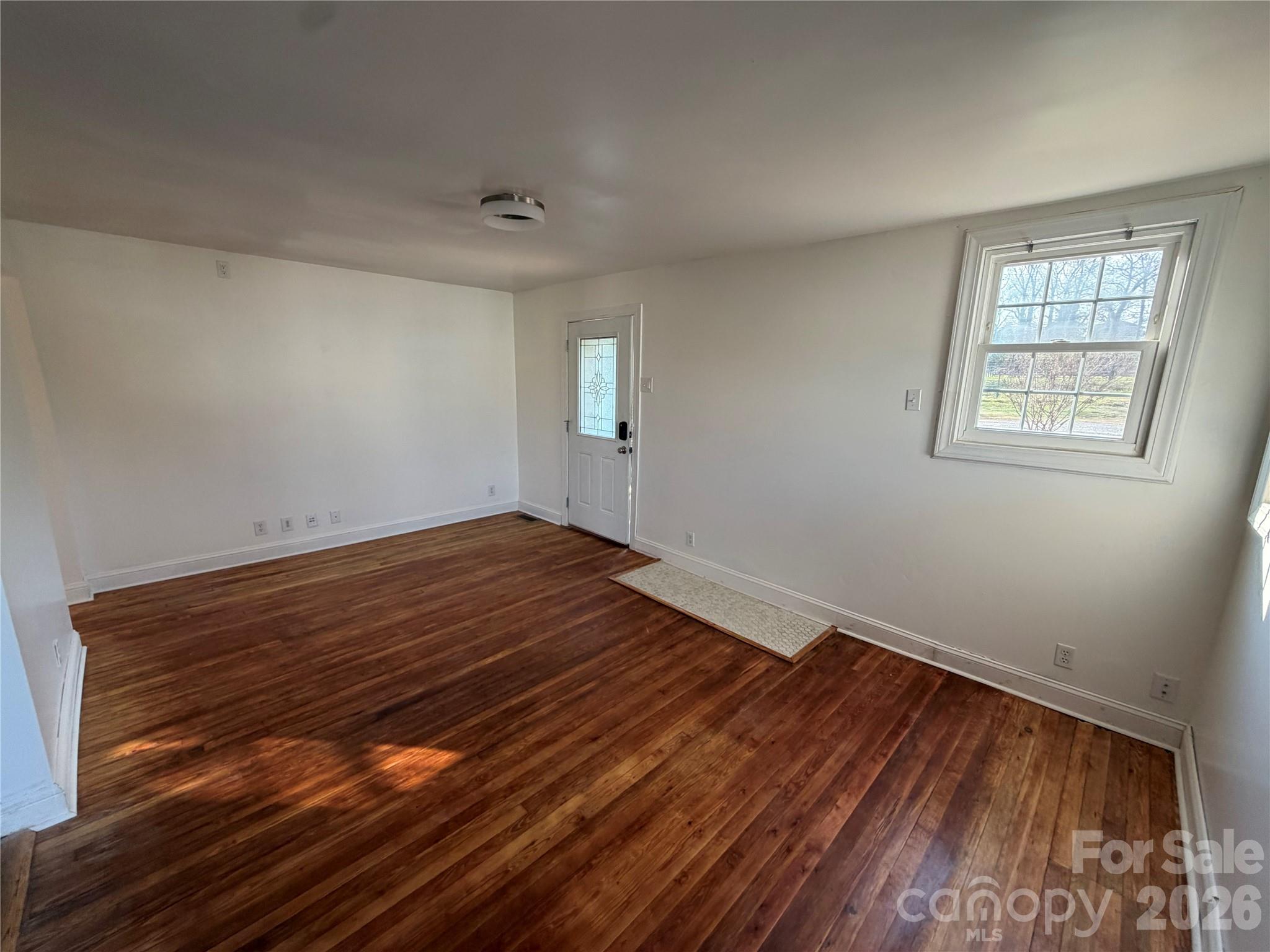 405 Jug Wilson Street Morganton, NC 28655 - Photo 3 of 21 a view of small space with wooden floor and windows