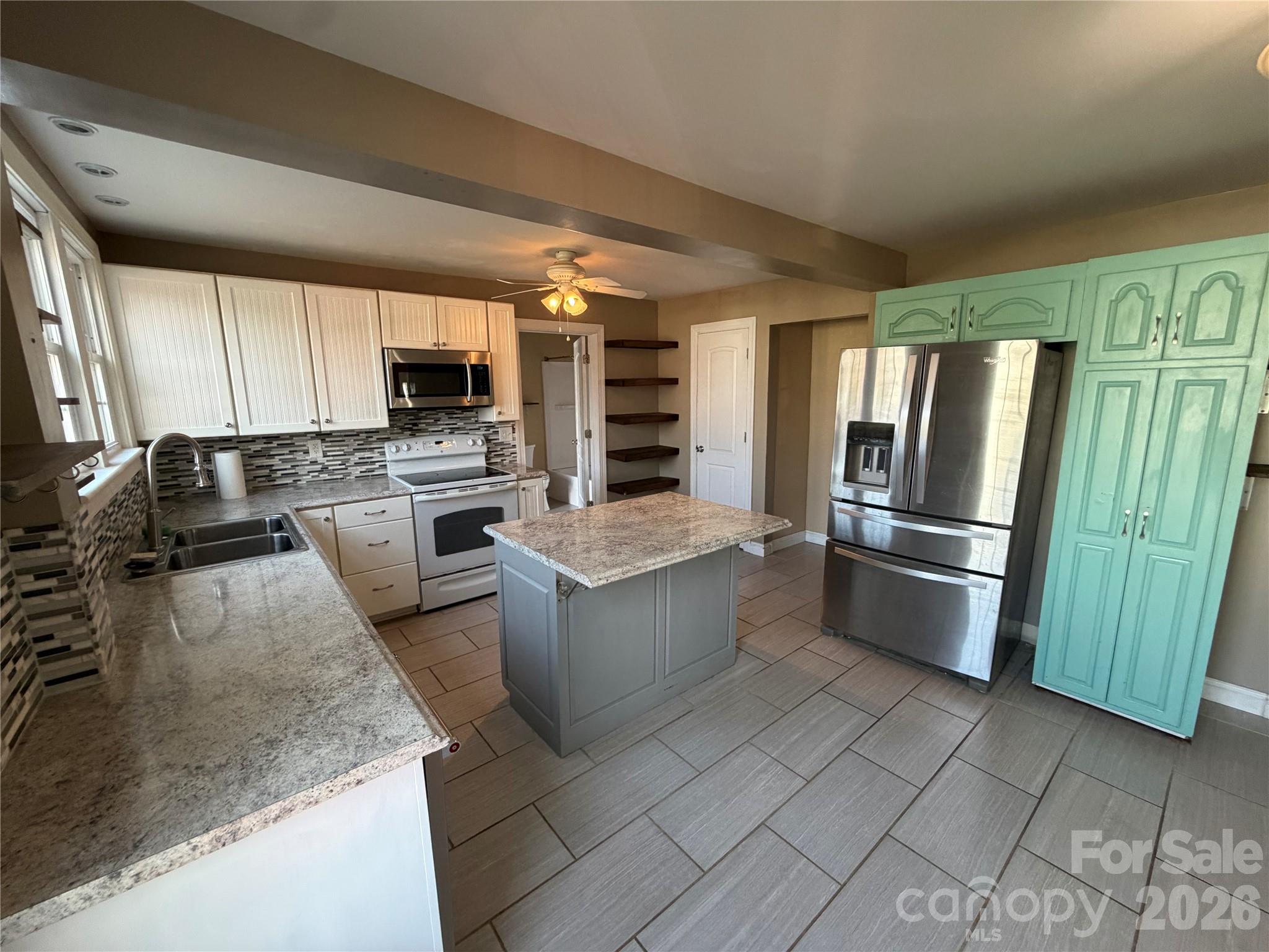 405 Jug Wilson Street Morganton, NC 28655 - Photo 5 of 21 a kitchen with stainless steel appliances granite countertop a refrigerator stove and sink