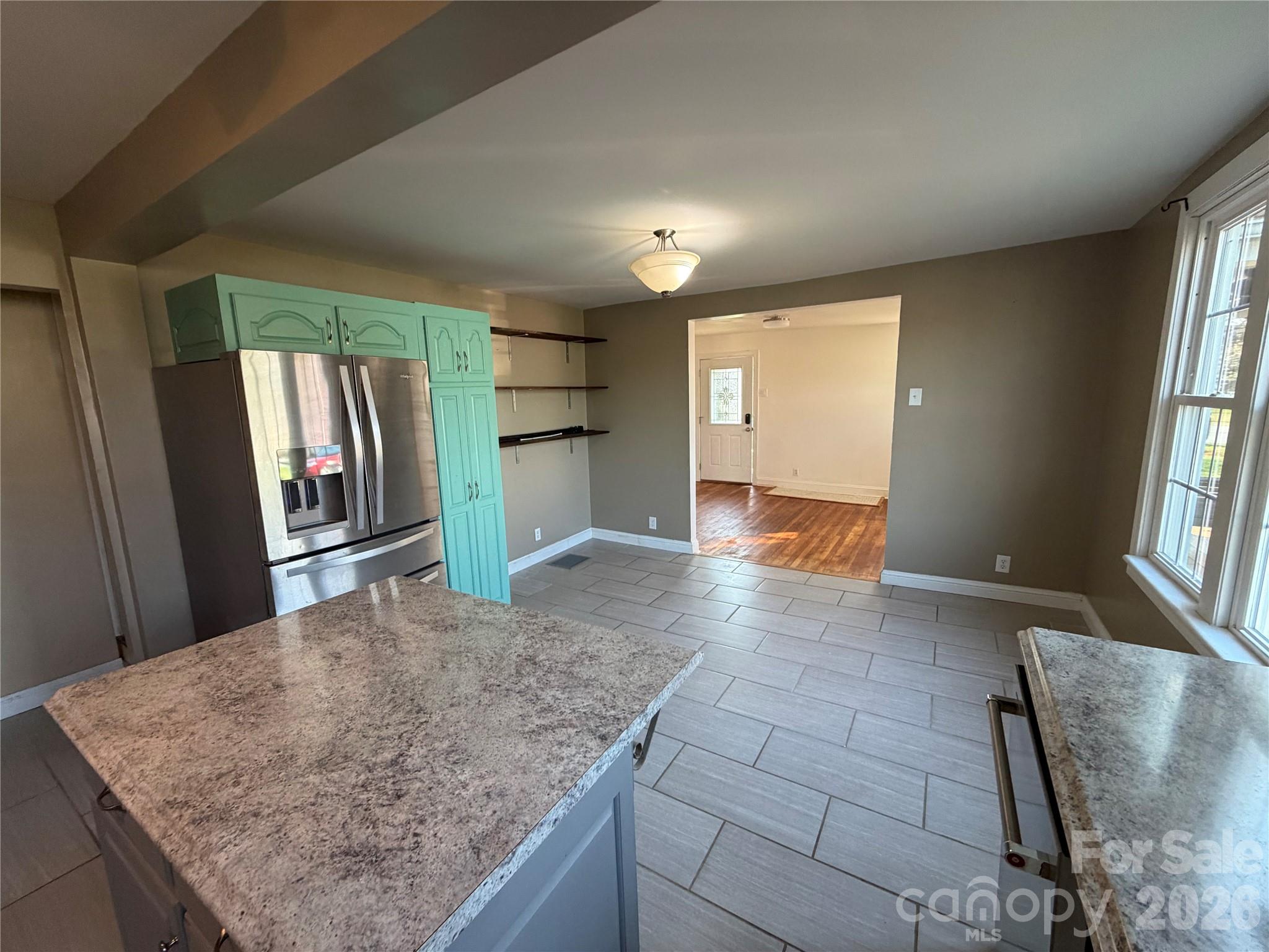 405 Jug Wilson Street Morganton, NC 28655 - Photo 6 of 21 a view of kitchen with granite countertop sink and washing machine