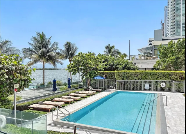 a view of swimming pool from a balcony