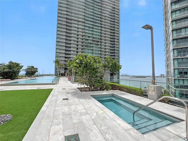 a view of swimming pool from a balcony