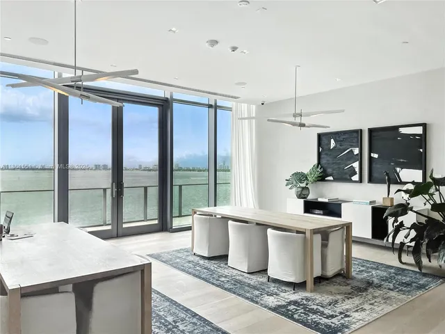 a very nice looking living room with a large window