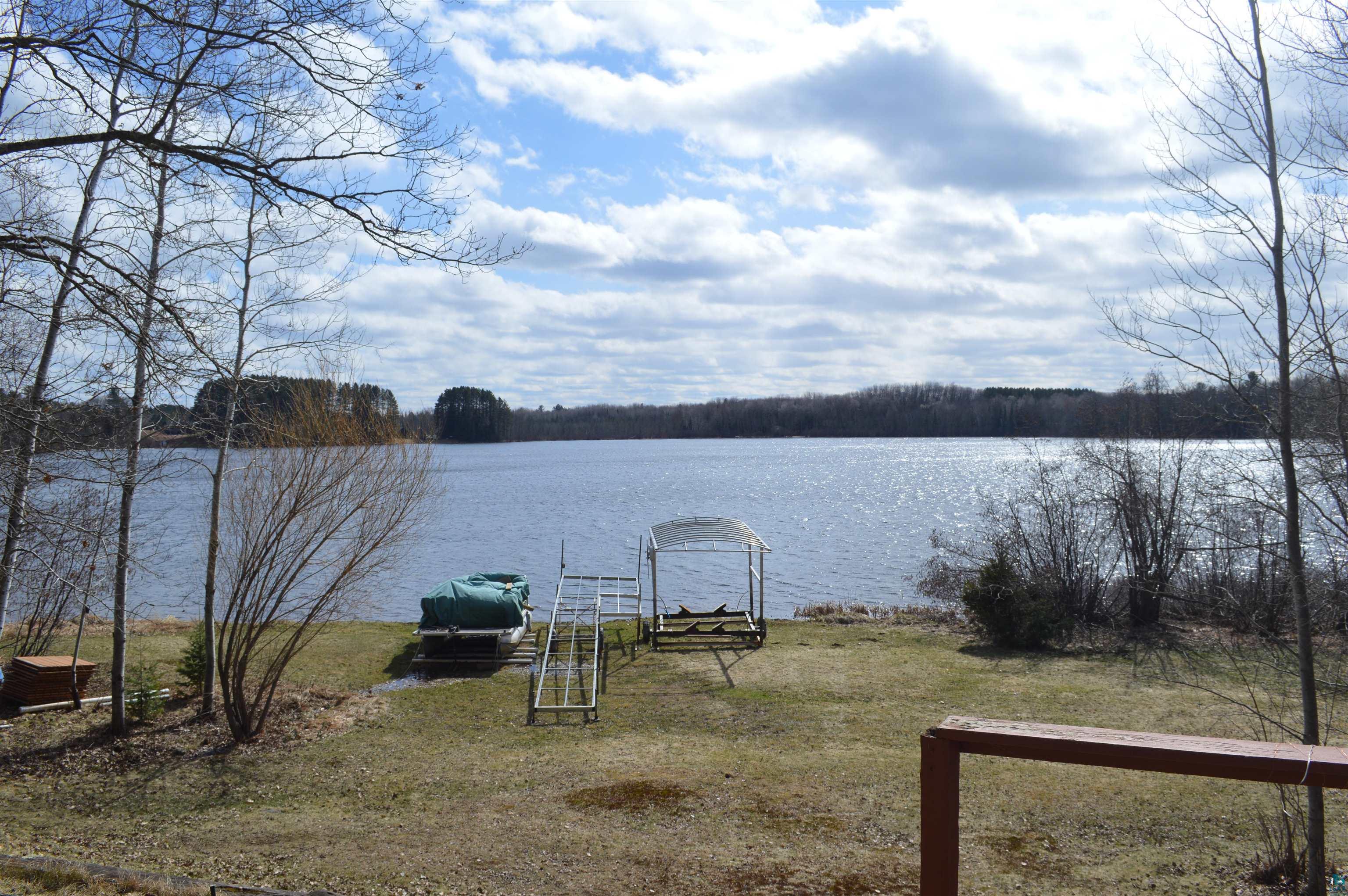 8467 County Rd P Lake Nebagamon, WI 54849 - Photo 18 of 25 Expansive waterfront property featuring a boat launch, boat hoist, and direct water access