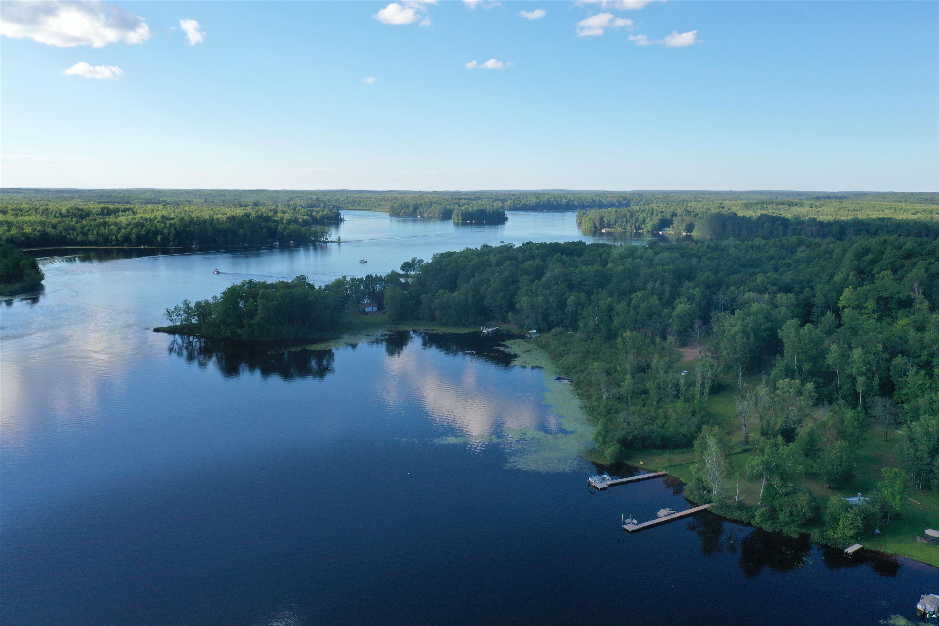 8467 County Rd P Lake Nebagamon, WI 54849 - Photo 23 of 25 Expansive waterfront property featuring mature woodlands, multiple private docks, and direct water access