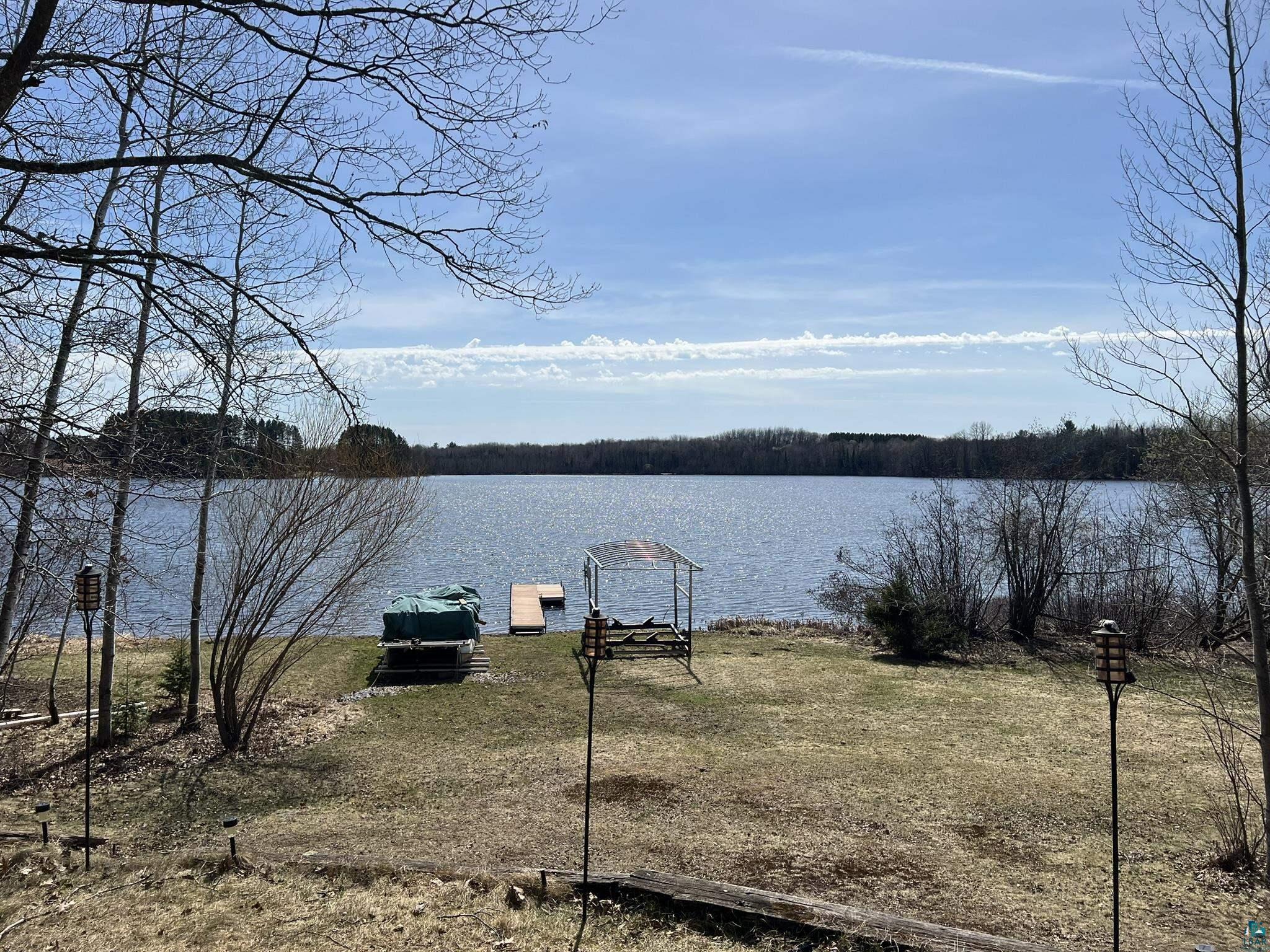 8467 County Rd P Lake Nebagamon, WI 54849 - Photo 3 of 25 Expansive lakefront property featuring a private dock, boat lift, and waterfront access