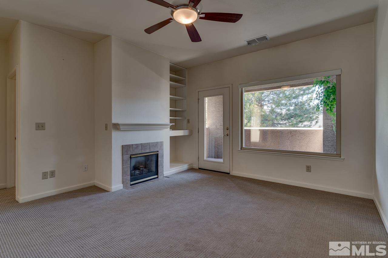 900 S Meadows, Unit 2623 Reno, NV 89521 - Photo 11 of 28 a view of an empty room with window and fire place