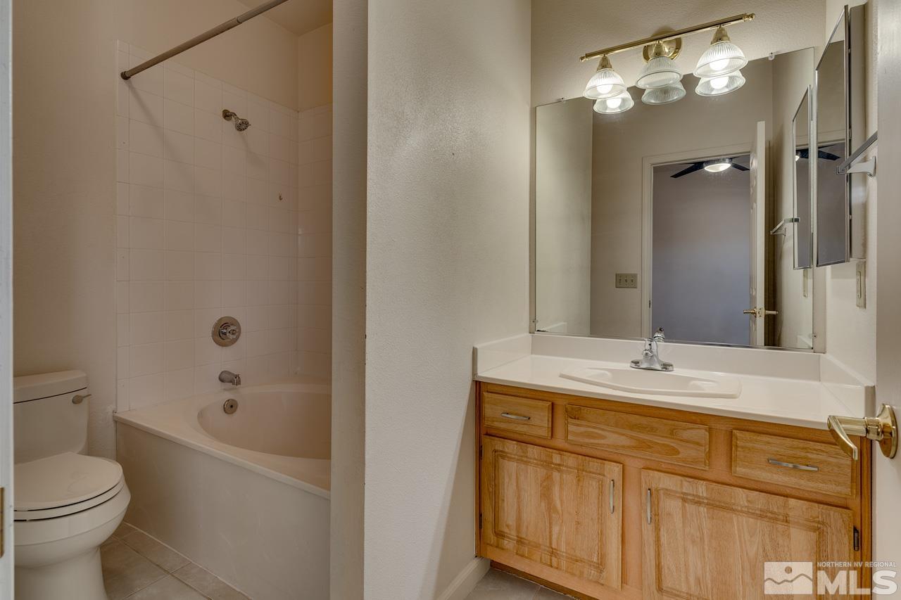 900 S Meadows, Unit 2623 Reno, NV 89521 - Photo 15 of 28 a bathroom with a sink a toilet and shower