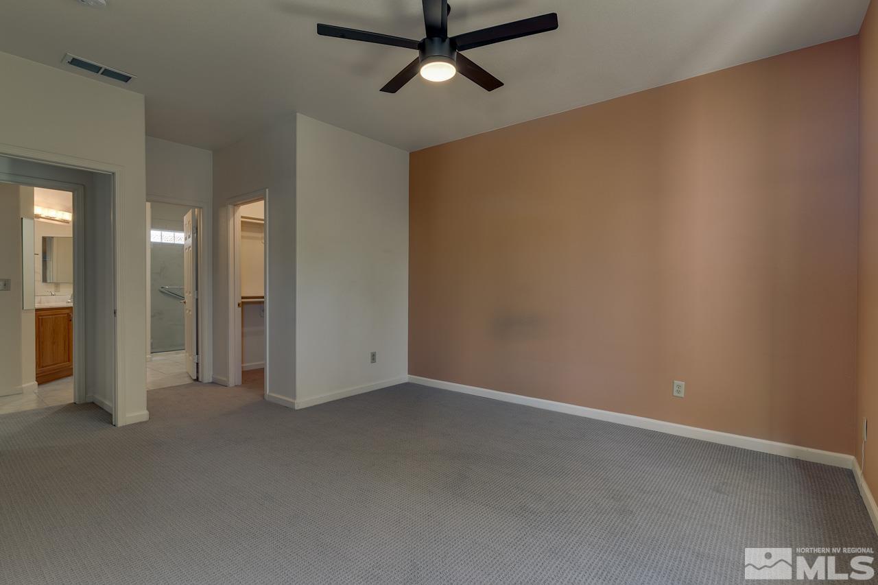 900 S Meadows, Unit 2623 Reno, NV 89521 - Photo 20 of 28 an empty room with chandelier fan