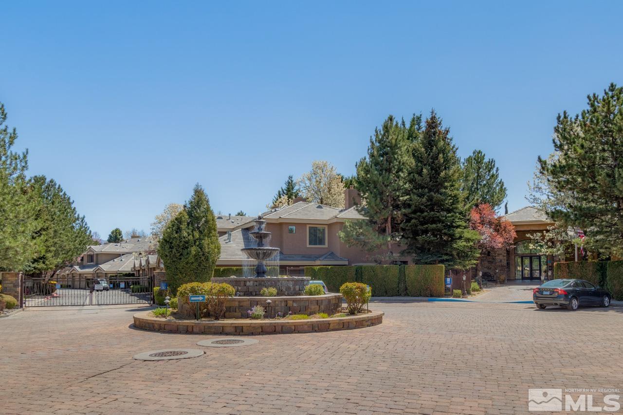900 S Meadows, Unit 2623 Reno, NV 89521 - Photo 25 of 28 a front view of a house with a garden and a yard