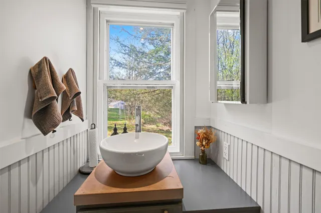 a bed room with a bed and potted plant