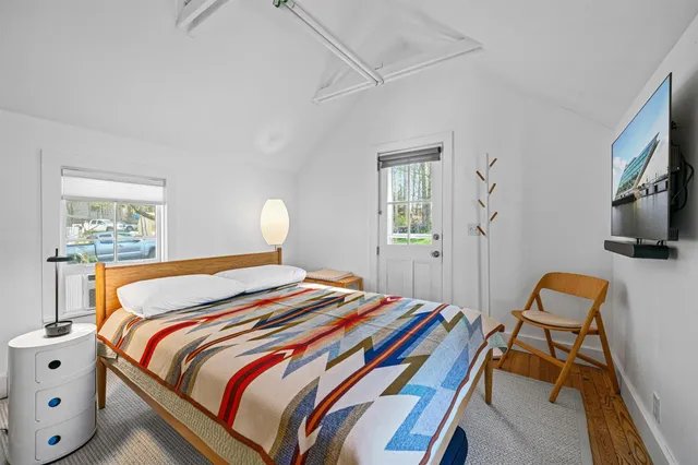 a view of a table and chairs under an umbrella
