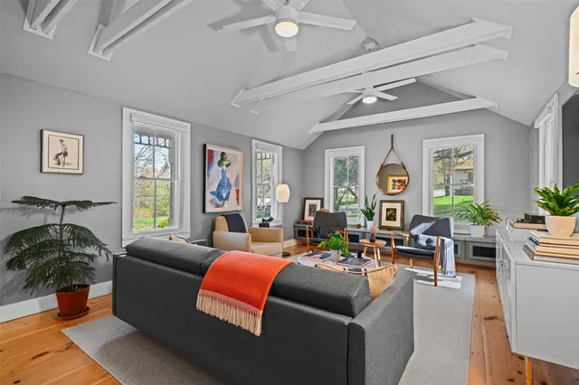 a view of a dining room with furniture and window
