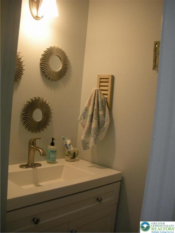 1201 Butztown Road, Unit 1 Bethlehem, PA 18017 - Photo 17 of 39 a bathroom with a sink and a mirror