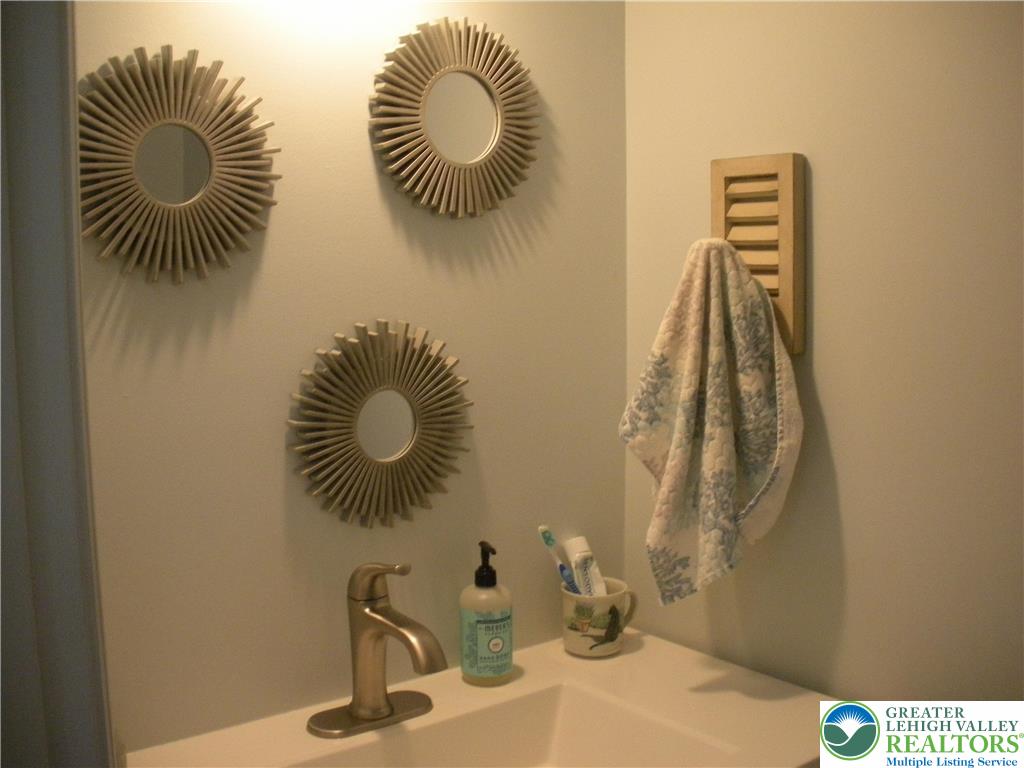 1201 Butztown Road, Unit 1 Bethlehem, PA 18017 - Photo 19 of 39 a bathroom with a sink mirror and vanity
