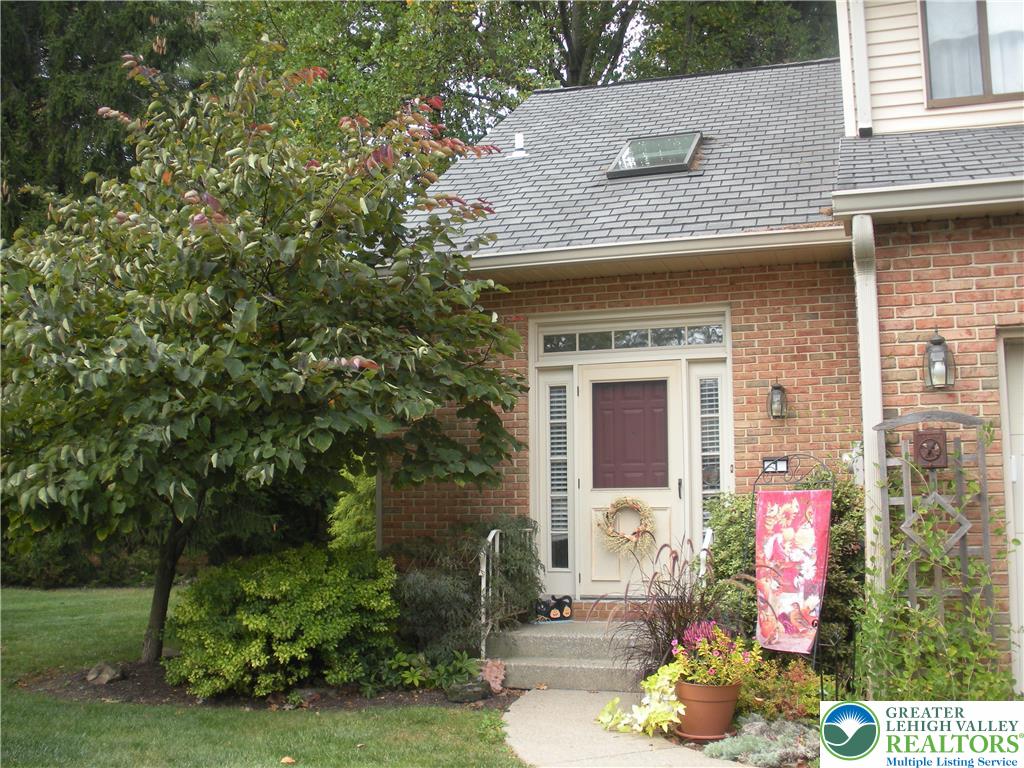 1201 Butztown Road, Unit 1 Bethlehem, PA 18017 - Photo 2 of 39 a front view of a house with a yard