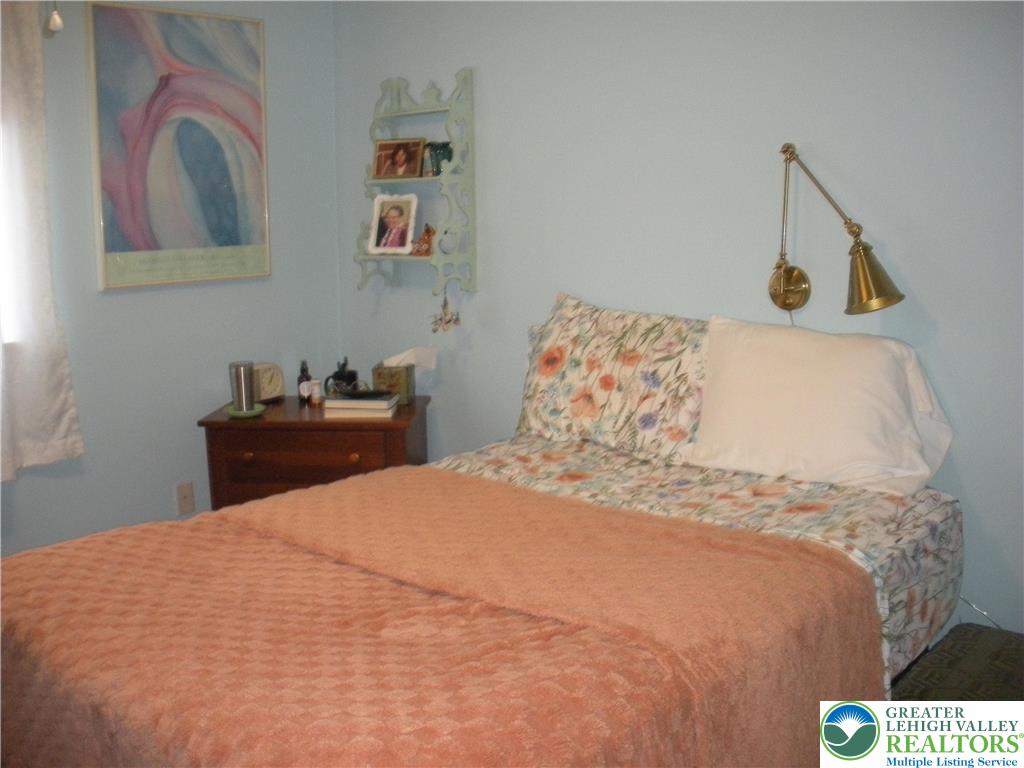 1201 Butztown Road, Unit 1 Bethlehem, PA 18017 - Photo 22 of 39 a bedroom with a bed and a desk