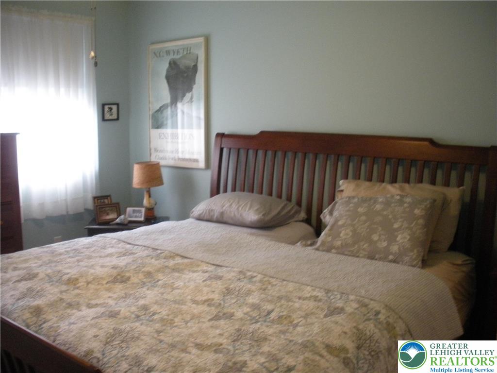 1201 Butztown Road, Unit 1 Bethlehem, PA 18017 - Photo 26 of 39 a bed sitting in a bedroom next to a window