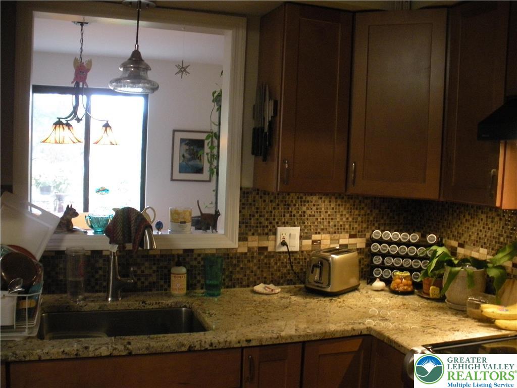 1201 Butztown Road, Unit 1 Bethlehem, PA 18017 - Photo 9 of 39 a kitchen with sink and refrigerator