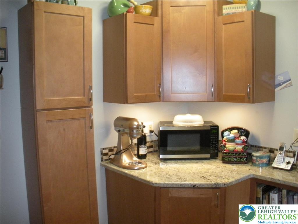 1201 Butztown Road, Unit 1 Bethlehem, PA 18017 - Photo 10 of 39 a kitchen with a stove and a refrigerator