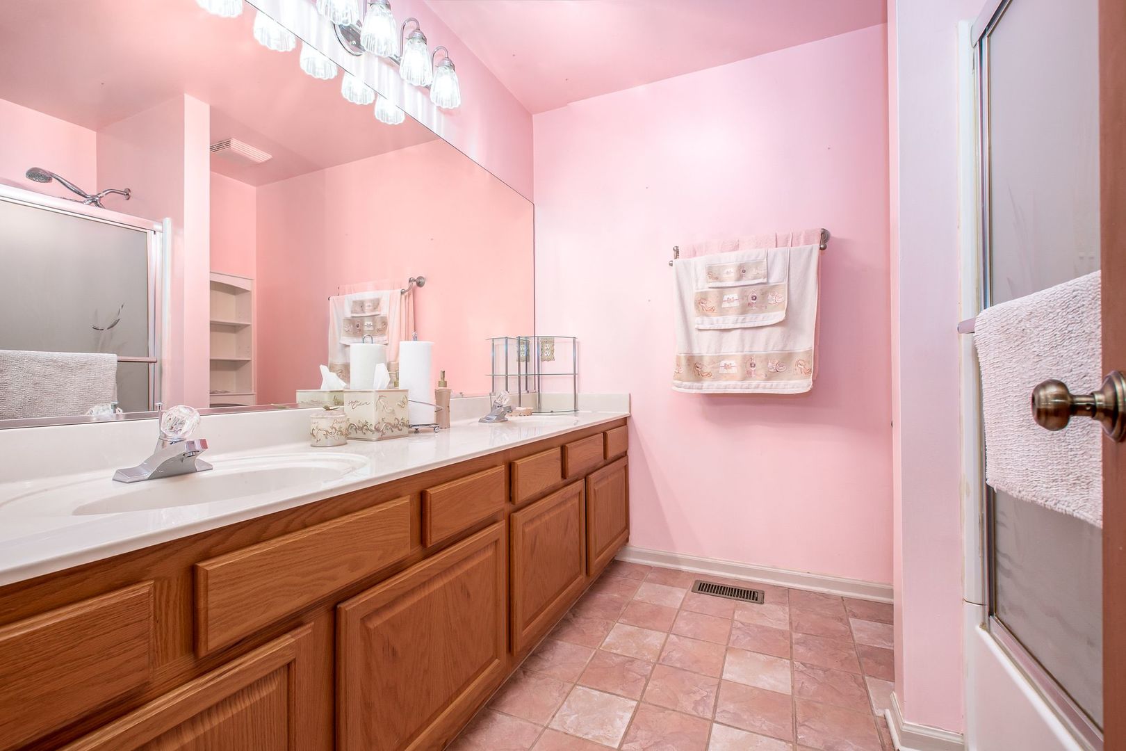 1925 Tilson Lane Romeoville, IL 60446 - Photo 20 of 27 a spacious bathroom with a granite countertop sink a mirror and a bathtub