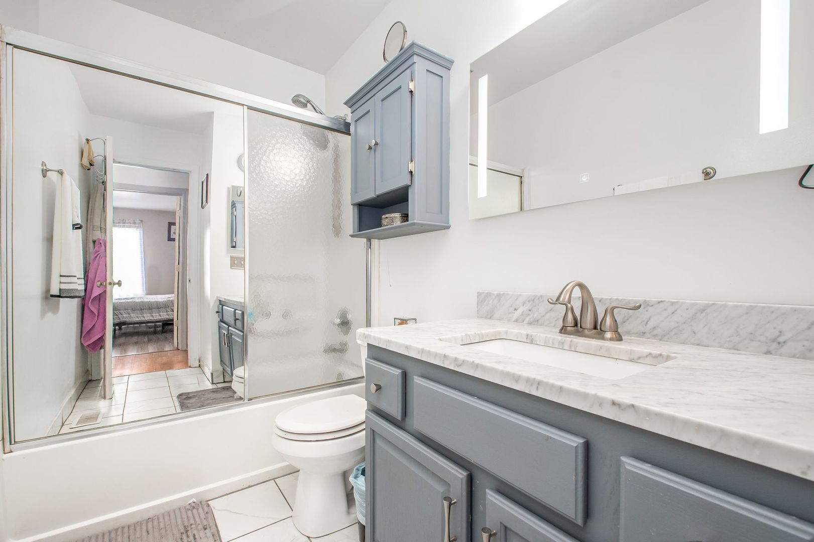 1925 Tilson Lane Romeoville, IL 60446 - Photo 23 of 27 a bathroom with a granite countertop sink toilet and shower