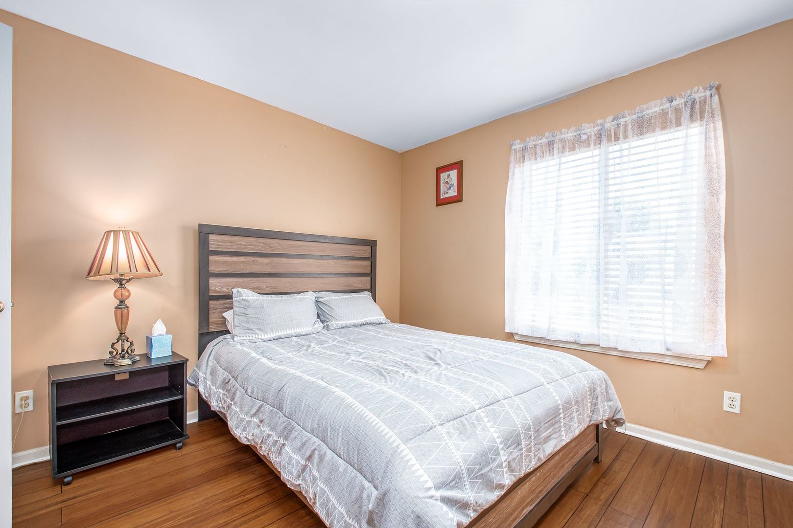 1925 Tilson Lane Romeoville, IL 60446 - Photo 24 of 27 a bedroom with a bed and a window