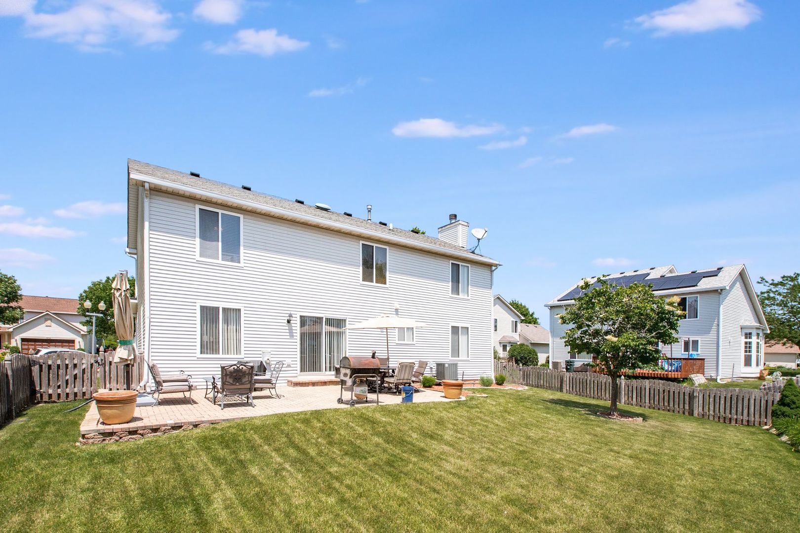 1925 Tilson Lane Romeoville, IL 60446 - Photo 4 of 27 a view of a house with backyard porch and sitting area