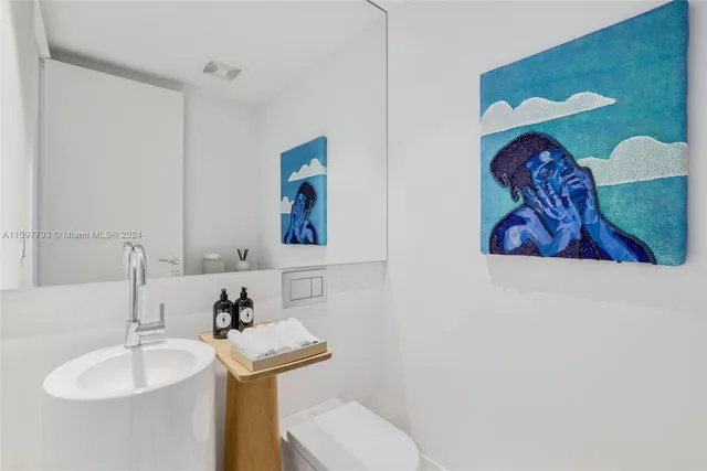 a view of a hallway with a sink and a window