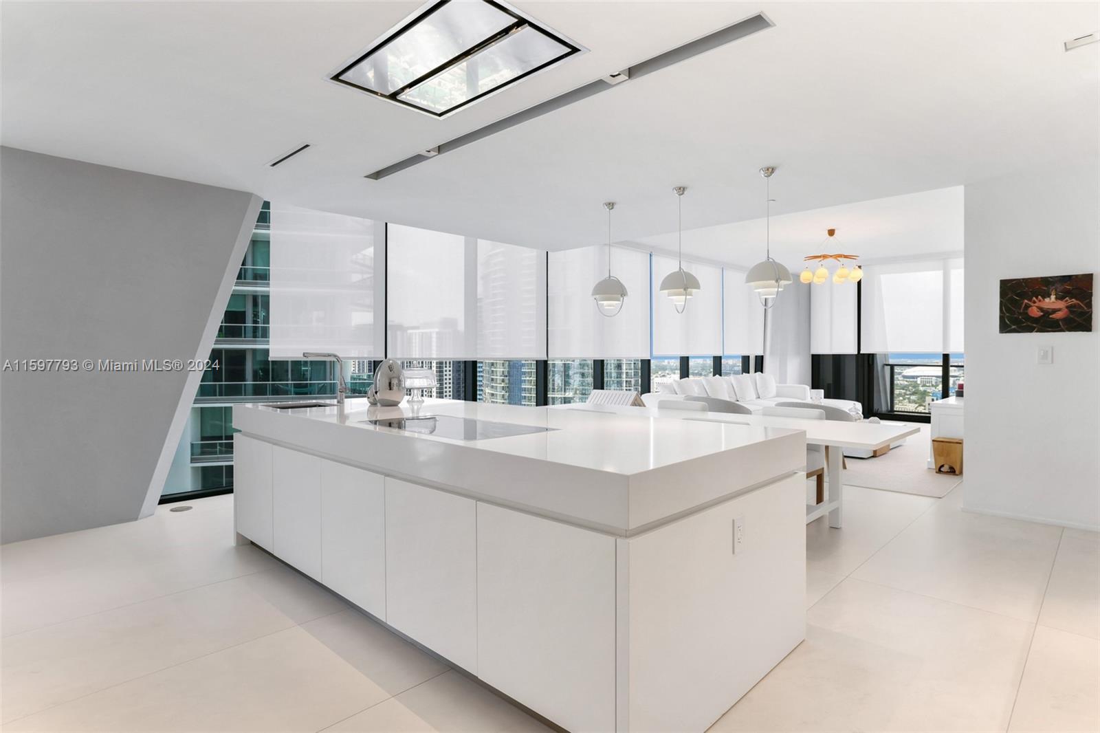 1000 Biscayne Boulevard, Unit 3701 Miami, FL 33132 - Photo 22 of 98 a large white kitchen with a large window and sink