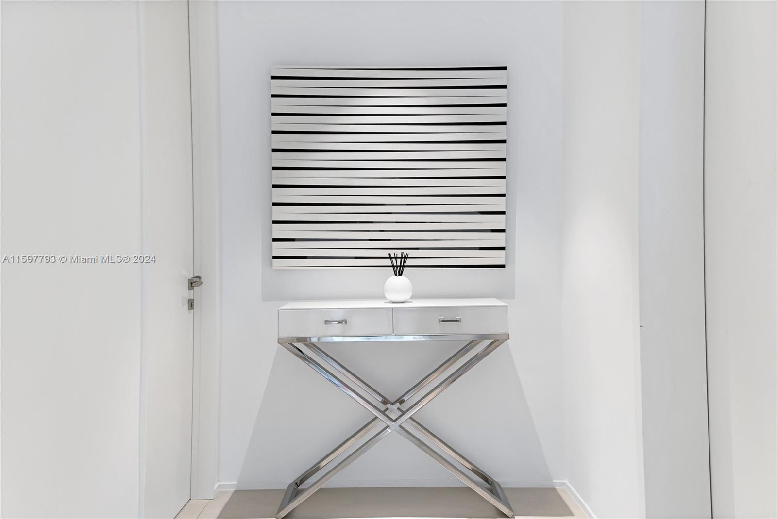 1000 Biscayne Boulevard, Unit 3701 Miami, FL 33132 - Photo 35 of 98 a view of a hallway with a sink and a window