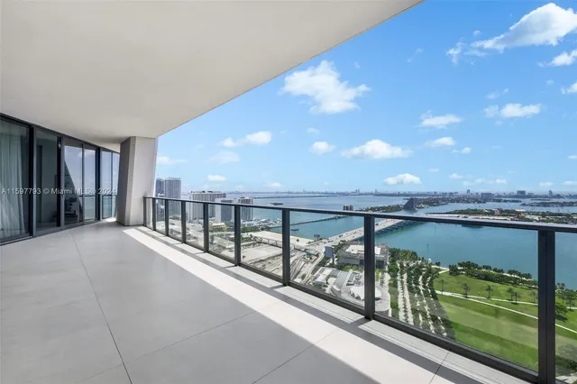 a living room with furniture and a piano