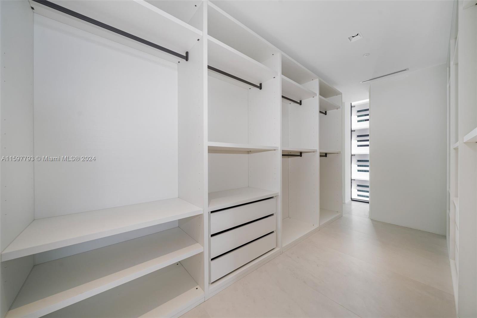 1000 Biscayne Boulevard, Unit 3701 Miami, FL 33132 - Photo 63 of 98 a view of an empty walk in closet
