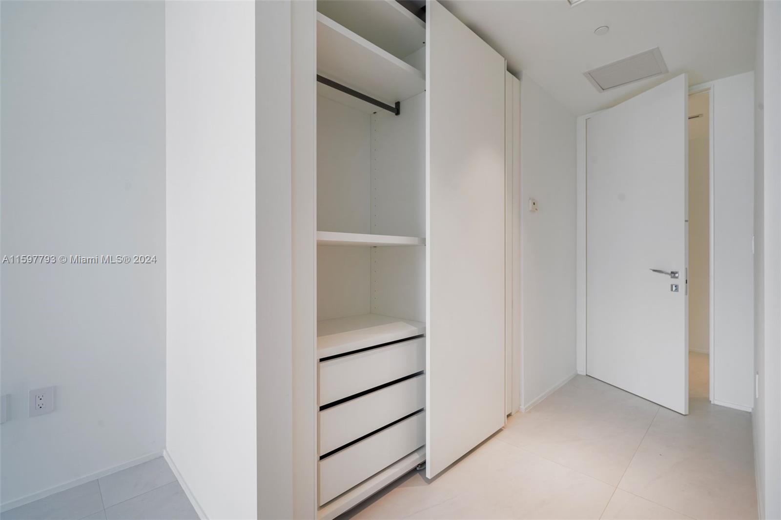 1000 Biscayne Boulevard, Unit 3701 Miami, FL 33132 - Photo 66 of 98 a view of an empty walk in closet