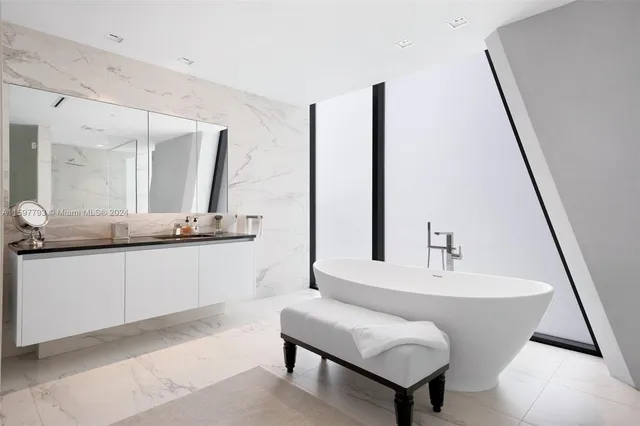 a living room with furniture kitchen and a chandelier