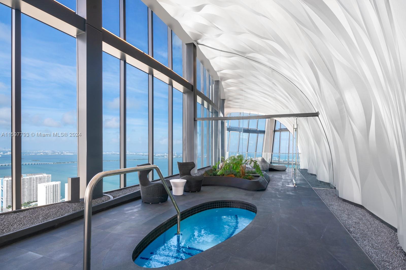 1000 Biscayne Boulevard, Unit 3701 Miami, FL 33132 - Photo 89 of 98 a dining room with furniture and wooden floor