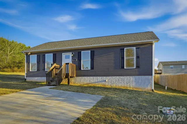 a view of a balcony with two chairs