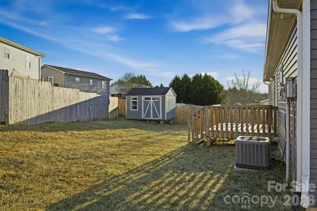 a living room with fireplace furniture and a chandelier